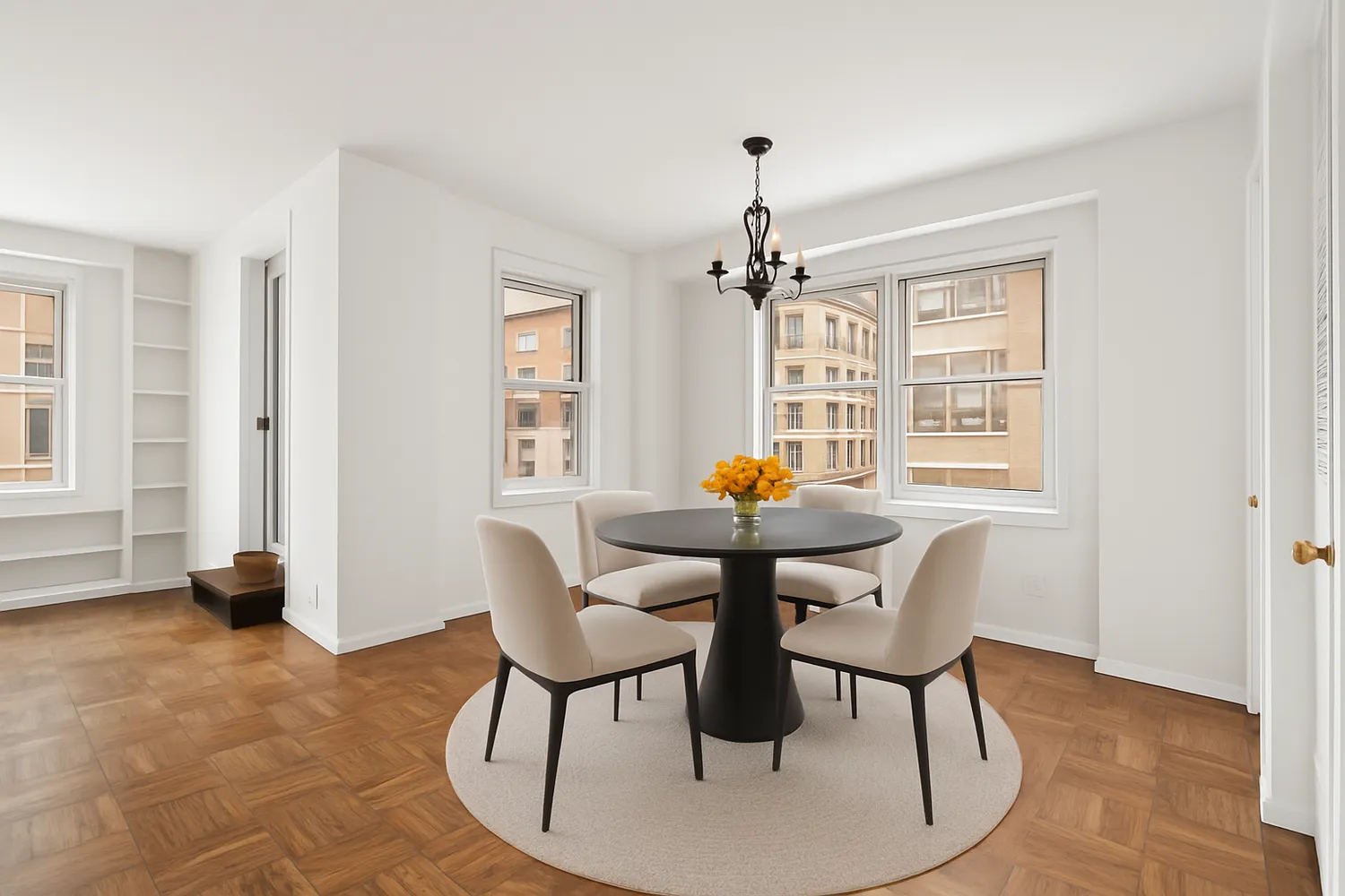 a view of a dining room with furniture and chandelier