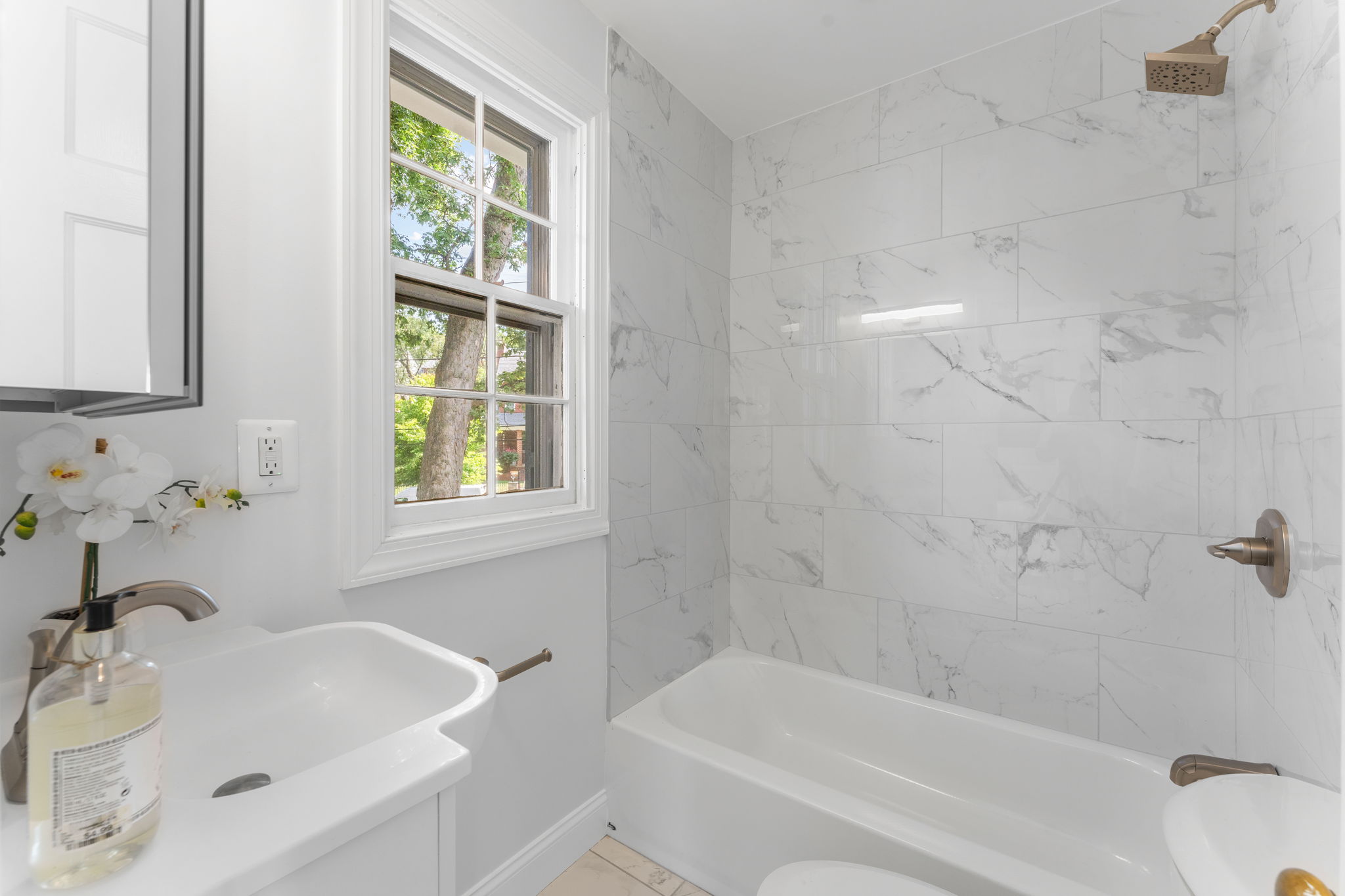 1325 Locust Road Northwest Washington, DC 20012 - Photo 30 of 56 a white bath tub with a window