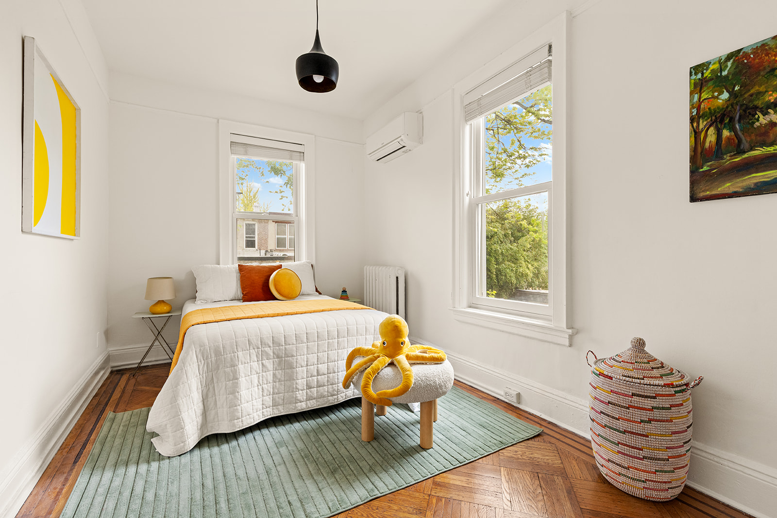 219 Fenimore Street Brooklyn, NY 11225 - Photo 16 of 24 a bedroom with a bed and wooden floor