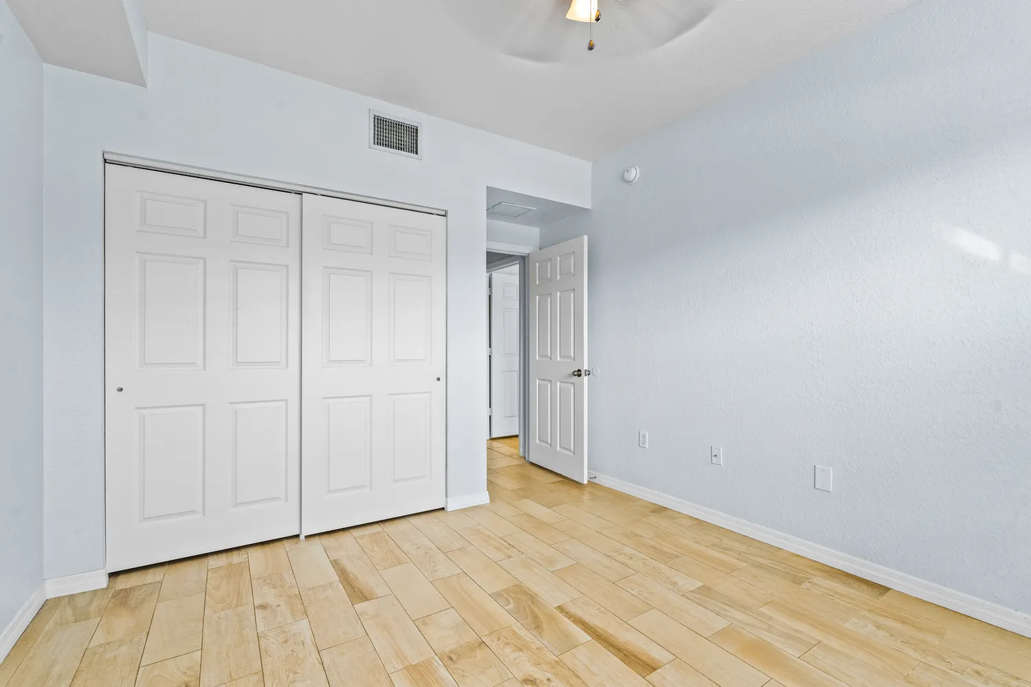 a view of an empty room with a window