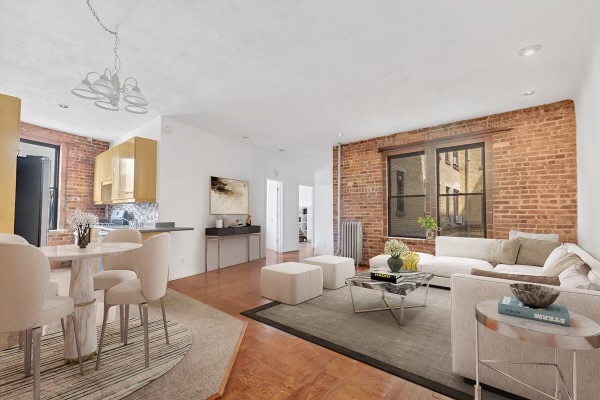 7609 4th Avenue, Unit B1 Brooklyn, NY 11209 - Photo 1 of 17 a living room with furniture and a chandelier