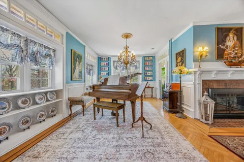 a view of a livingroom with furniture window and a fireplace