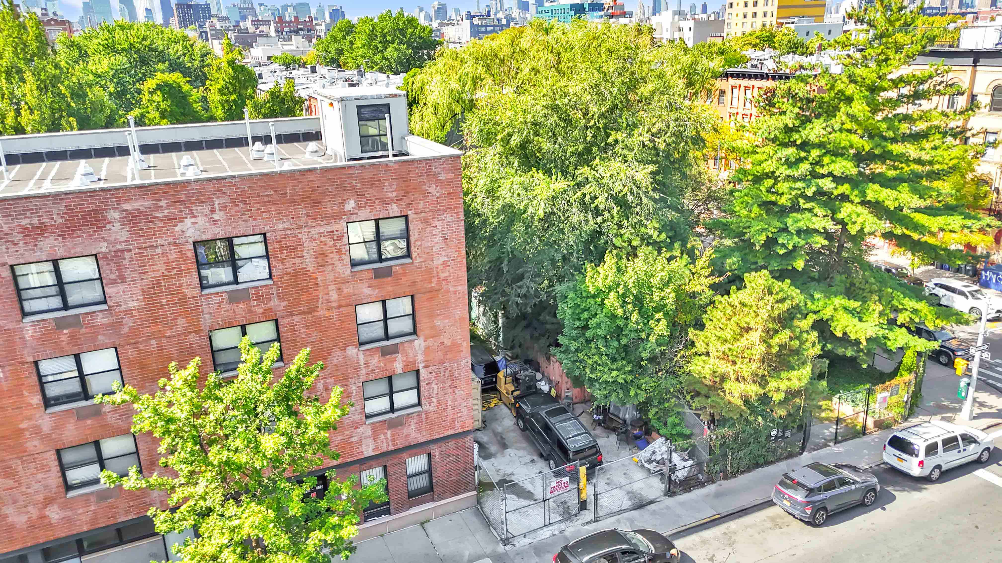 610 Marcy Avenue Brooklyn, NY 11206 - Photo 11 of 20 a view of a brick house with a yard