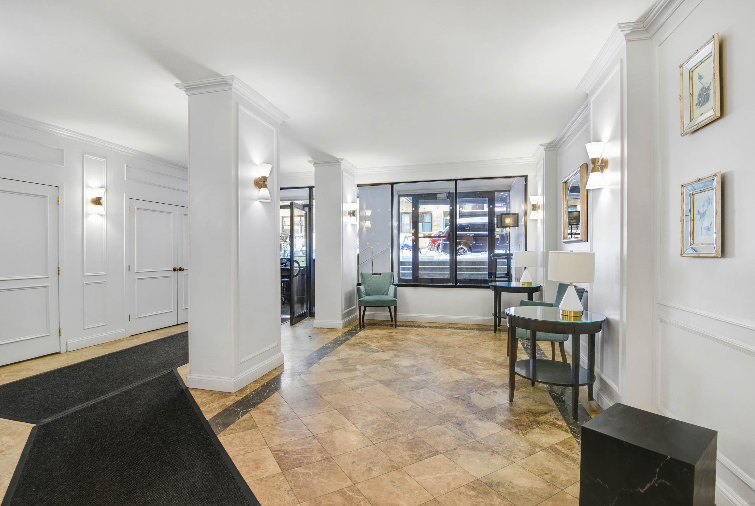 345 East 73rd Street, Unit 7J Manhattan, NY 10021 - Photo 11 of 13 a spacious bedroom with a bed and a table in it