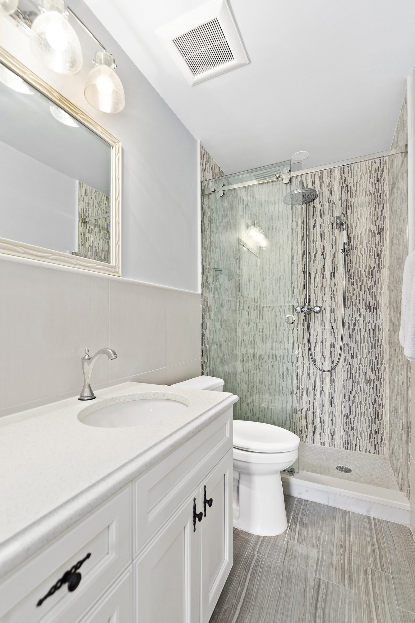 67 Greene Avenue, Unit 2 Brooklyn, NY 11238 - Photo 12 of 15 a bathroom with a sink a toilet and shower