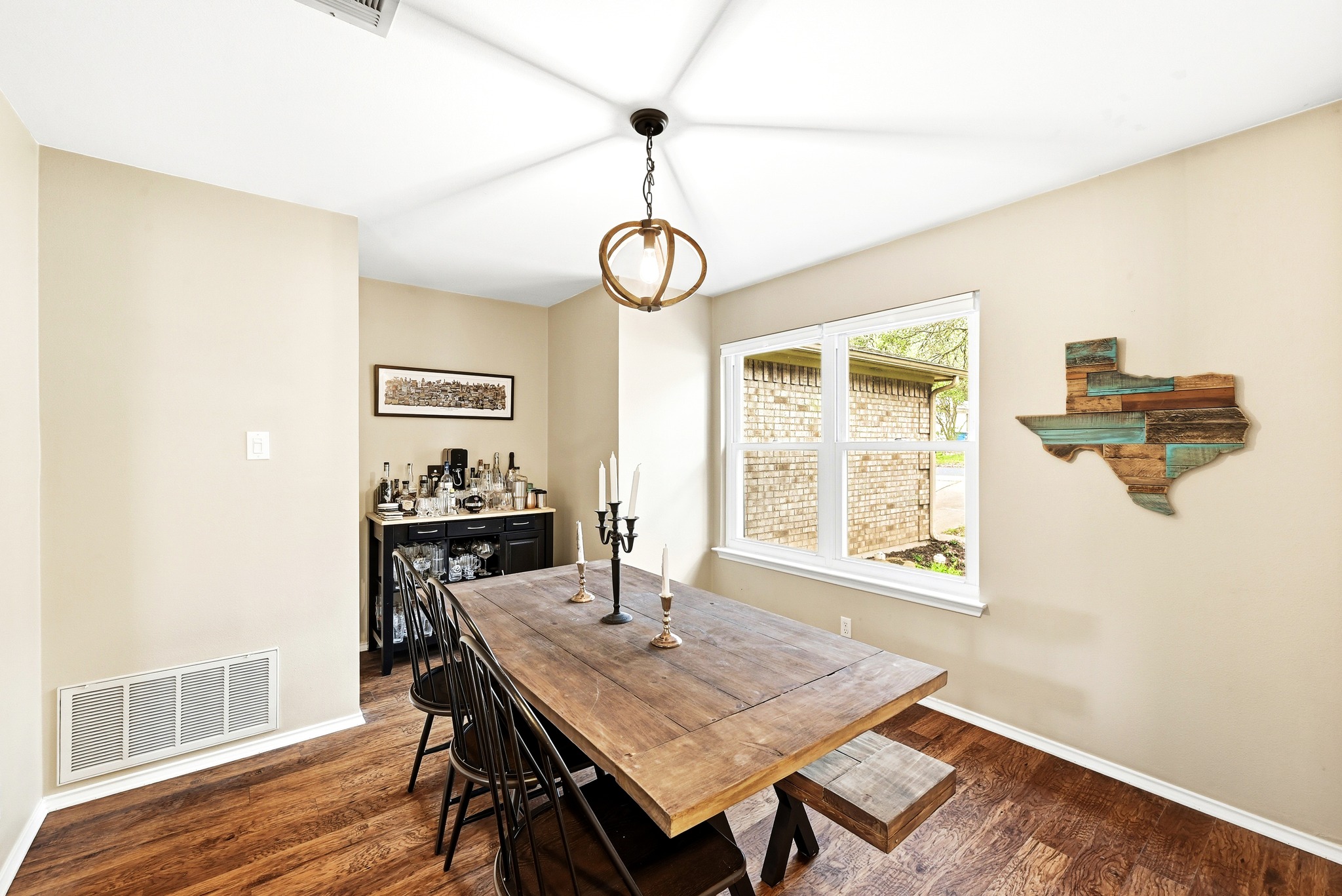 8901 Frock Court Austin, TX 78748 - Photo 12 of 28 a view of a dining room with furniture window and wooden floor
