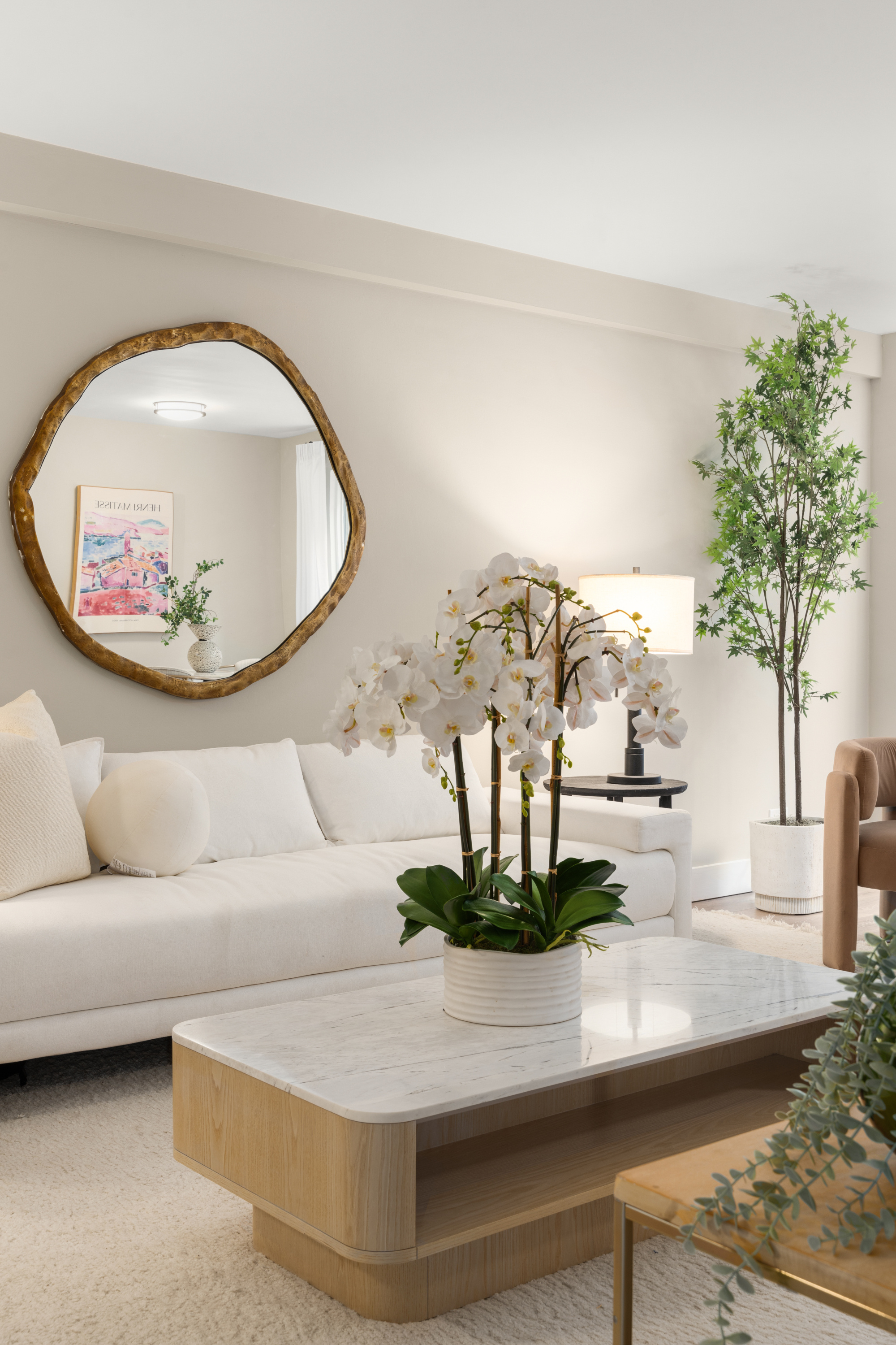 347 East 53rd Street, Unit 2C Manhattan, NY 10022 - Photo 3 of 18 a living room with furniture and a potted plant
