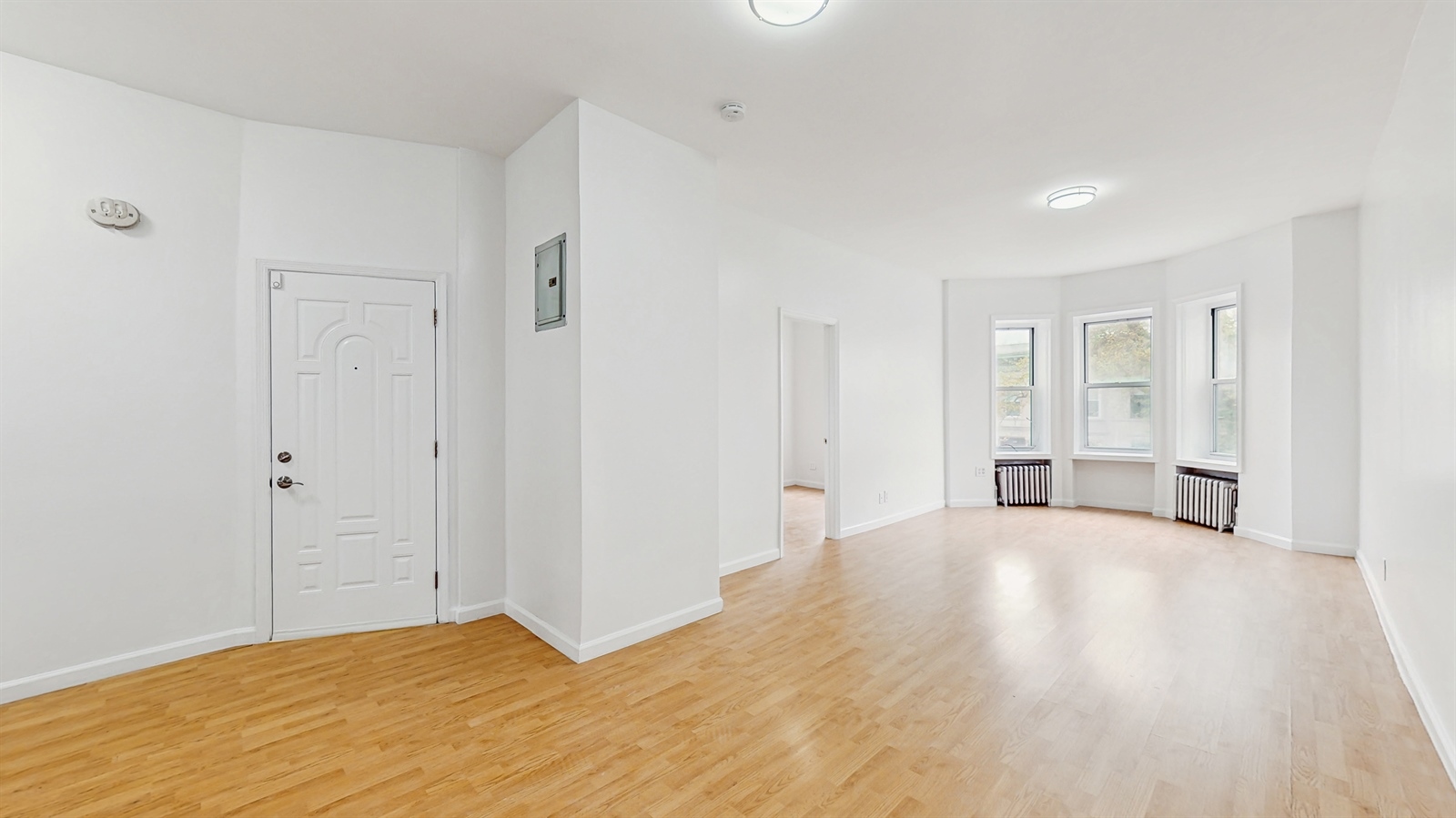 454 77th Street, Unit 3 Brooklyn, NY 11209 - Photo 9 of 25 a view of an empty room with wooden floor and closet
