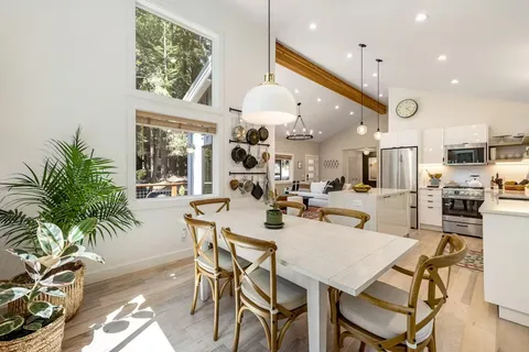 a kitchen with a table and chairs in it