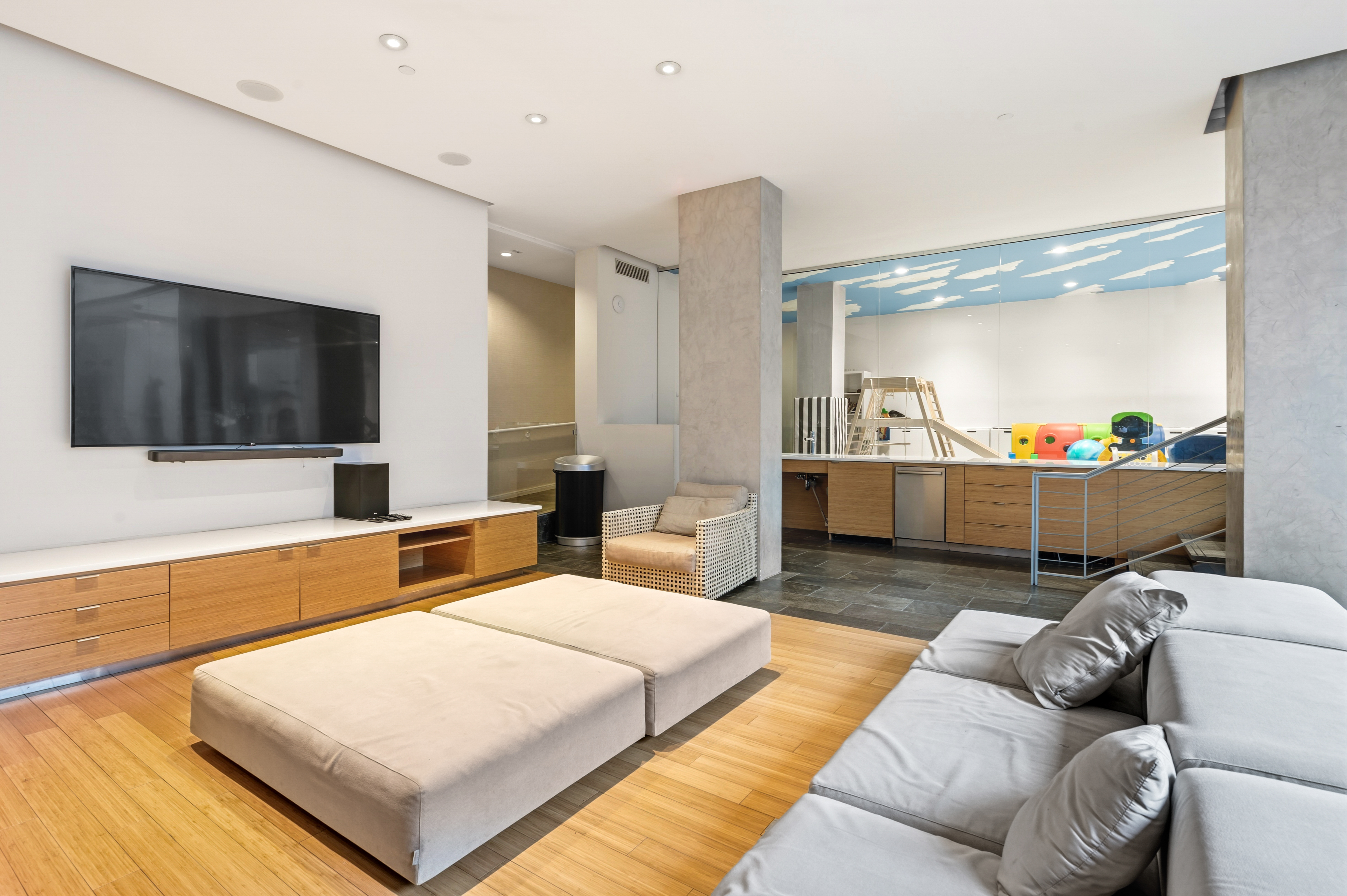 303 East 33rd Street, Unit 5H Manhattan, NY 10016 - Photo 11 of 18 a living room with furniture and a flat screen tv