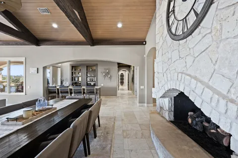 a view of a balcony with table and chairs