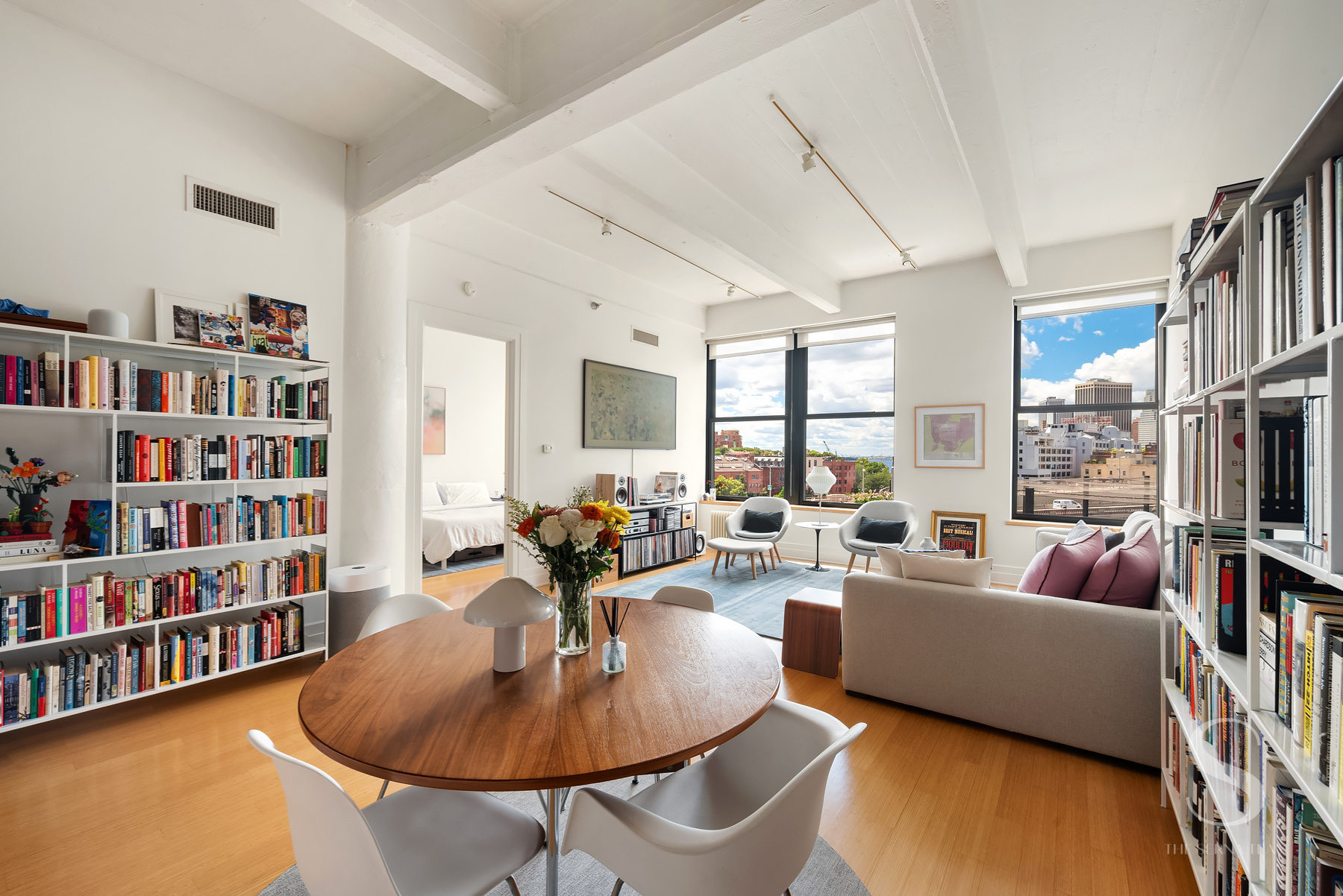 70 Washington Street, Unit 8H Brooklyn, NY 11201 - Photo 3 of 15 a living room with furniture and a book shelf