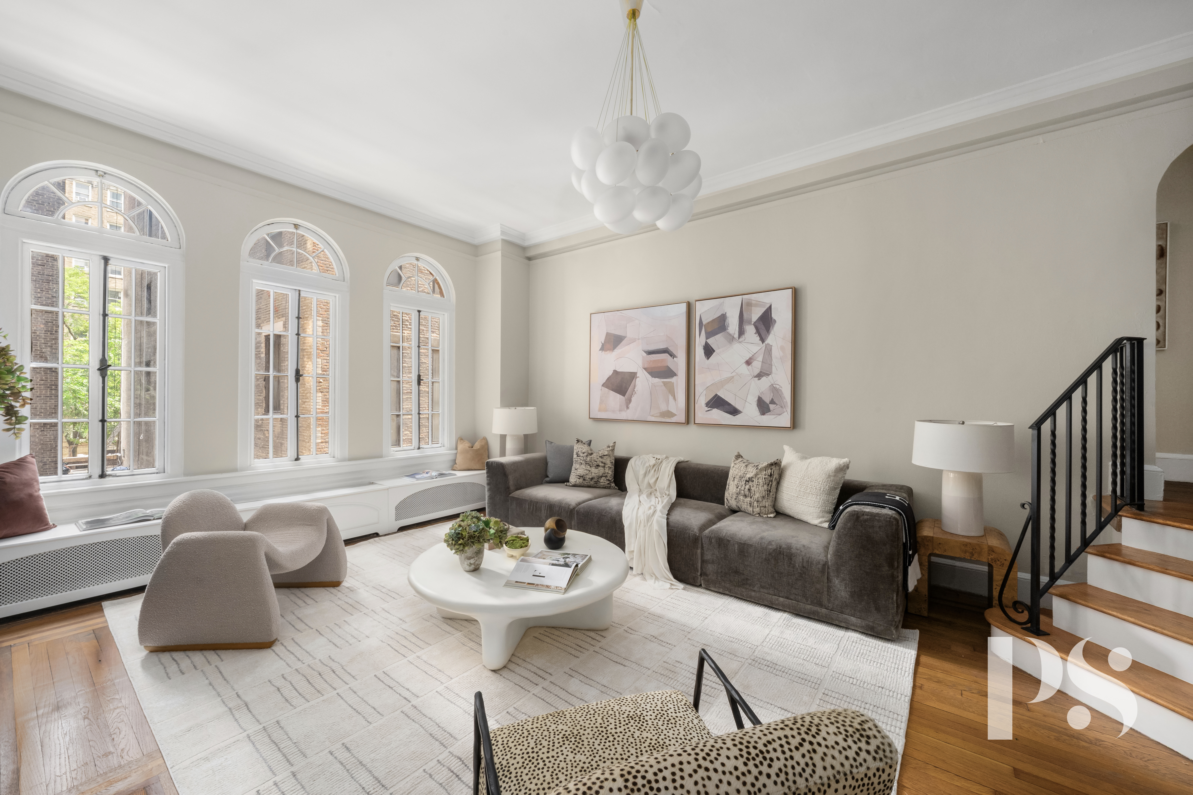 35 East 9th Street, Unit 33 Manhattan, NY 10003 - Photo 4 of 14 a living room with furniture chandelier and a table