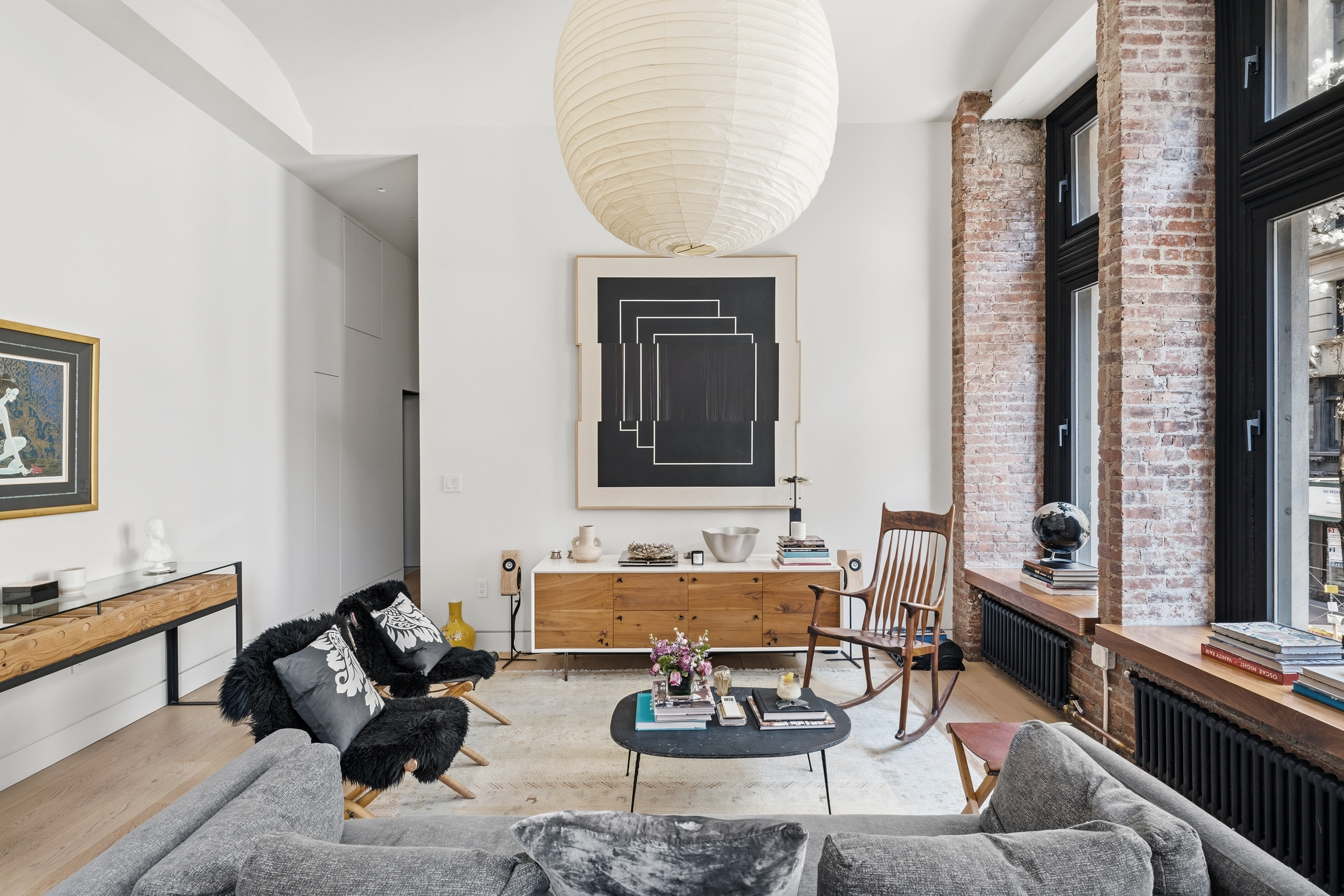 1 Great Jones St, Unit 2B Manhattan, NY 10012 - Photo 4 of 12 a living room with furniture and a window