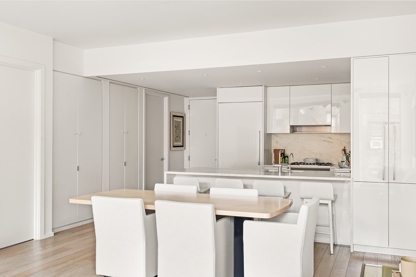 150 East 23rd Street, Unit 5D Manhattan, NY 10010 - Photo 2 of 12 a kitchen with a sink a refrigerator and cabinets