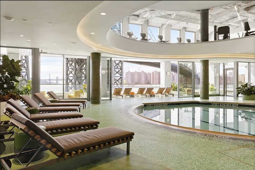 5 South 5th Street, Unit 5300 Brooklyn, NY 11249 - Photo 14 of 28 a living room with furniture and a large window