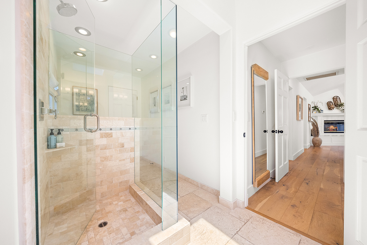 161 Loureyro Road Montecito, CA 93108 - Photo 14 of 52 a bathroom with a glass shower door mirror and shower