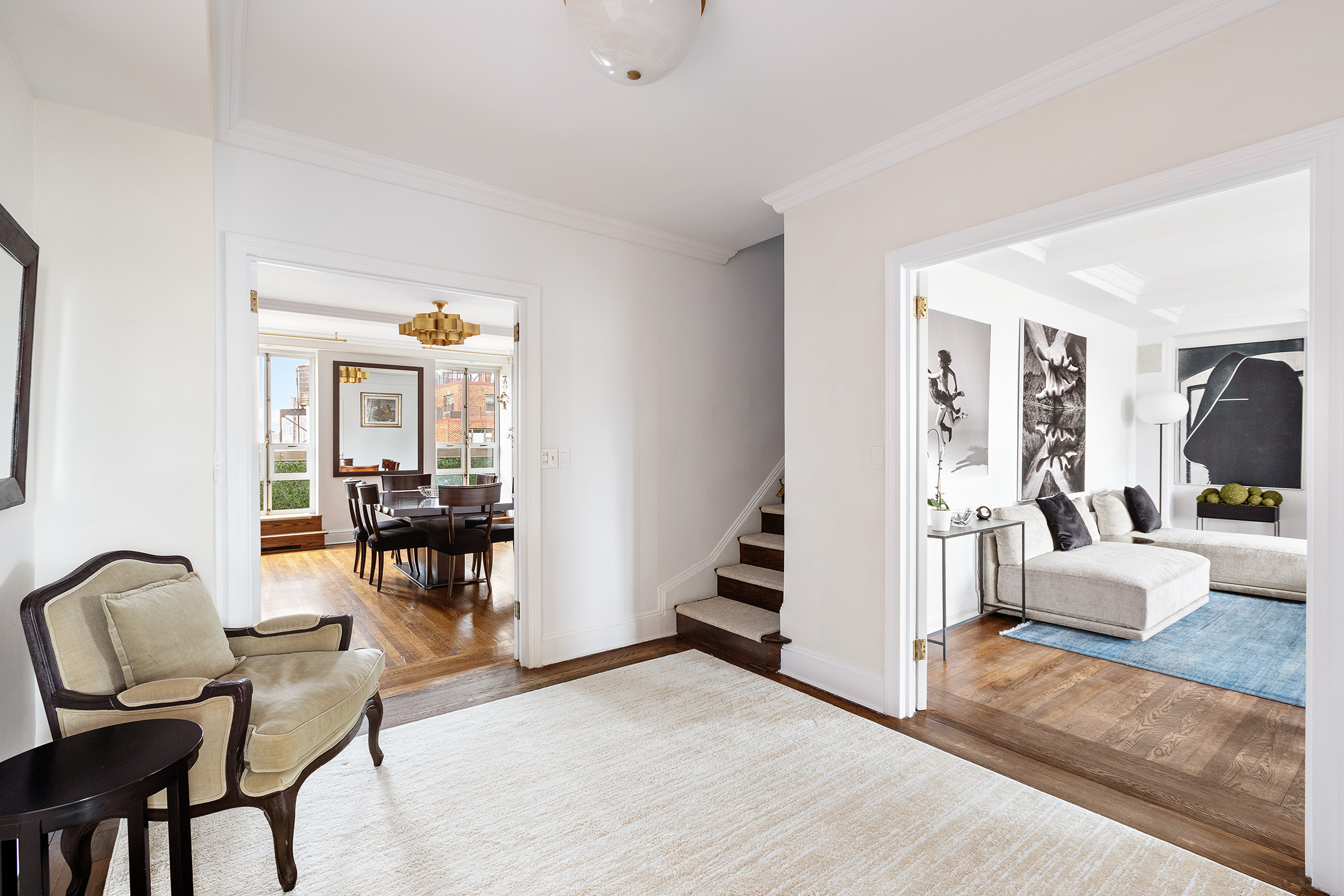 320 East 72nd Street, Unit PHB Manhattan, NY 10021 - Photo 4 of 26 a view of living room filled with furniture and a flat screen tv