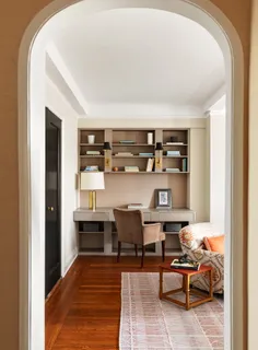 a living room with furniture and lamp