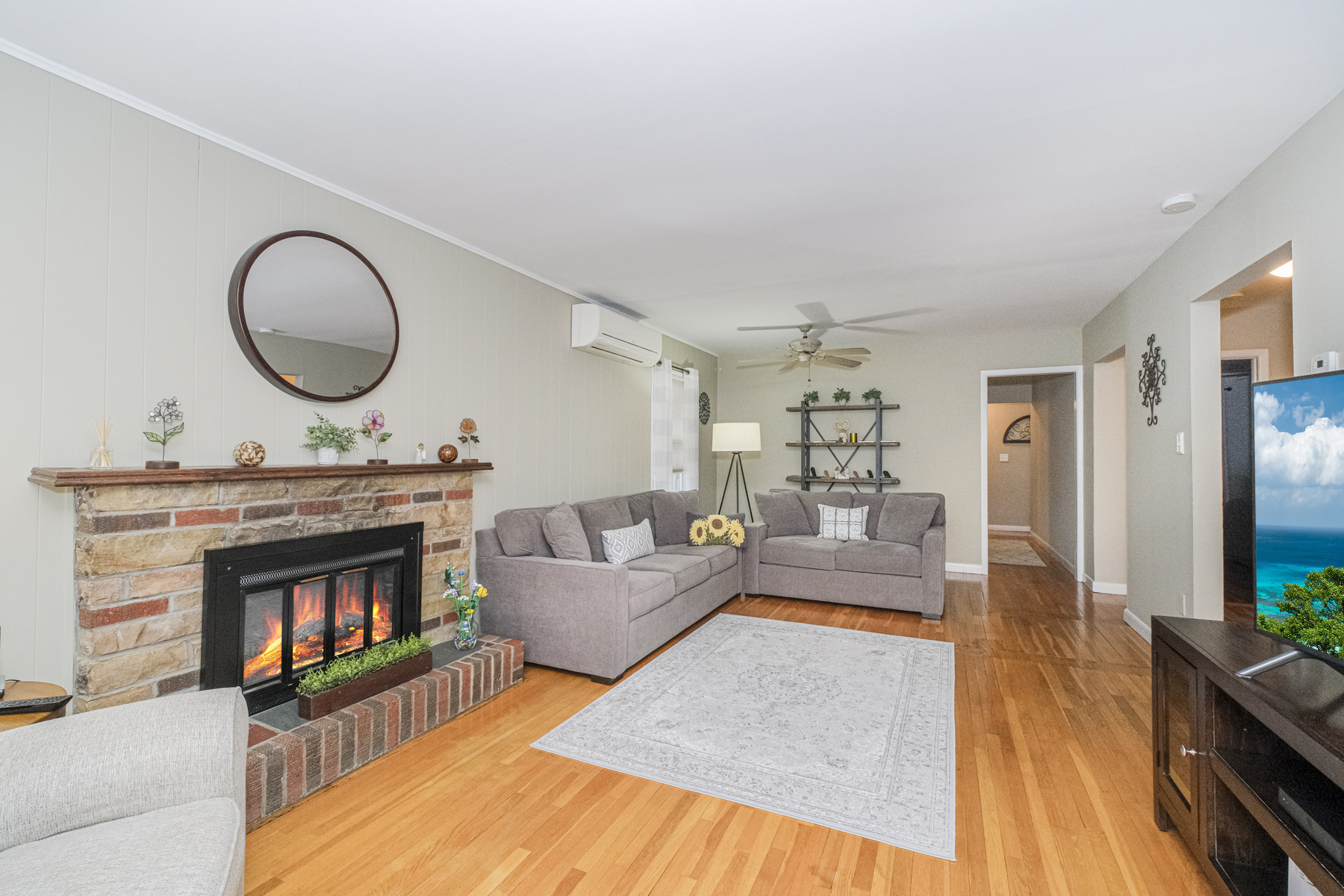 503 Falcon Avenue Staten Island, NY 10306 - Photo 6 of 30 a living room with furniture a fireplace and a flat screen tv