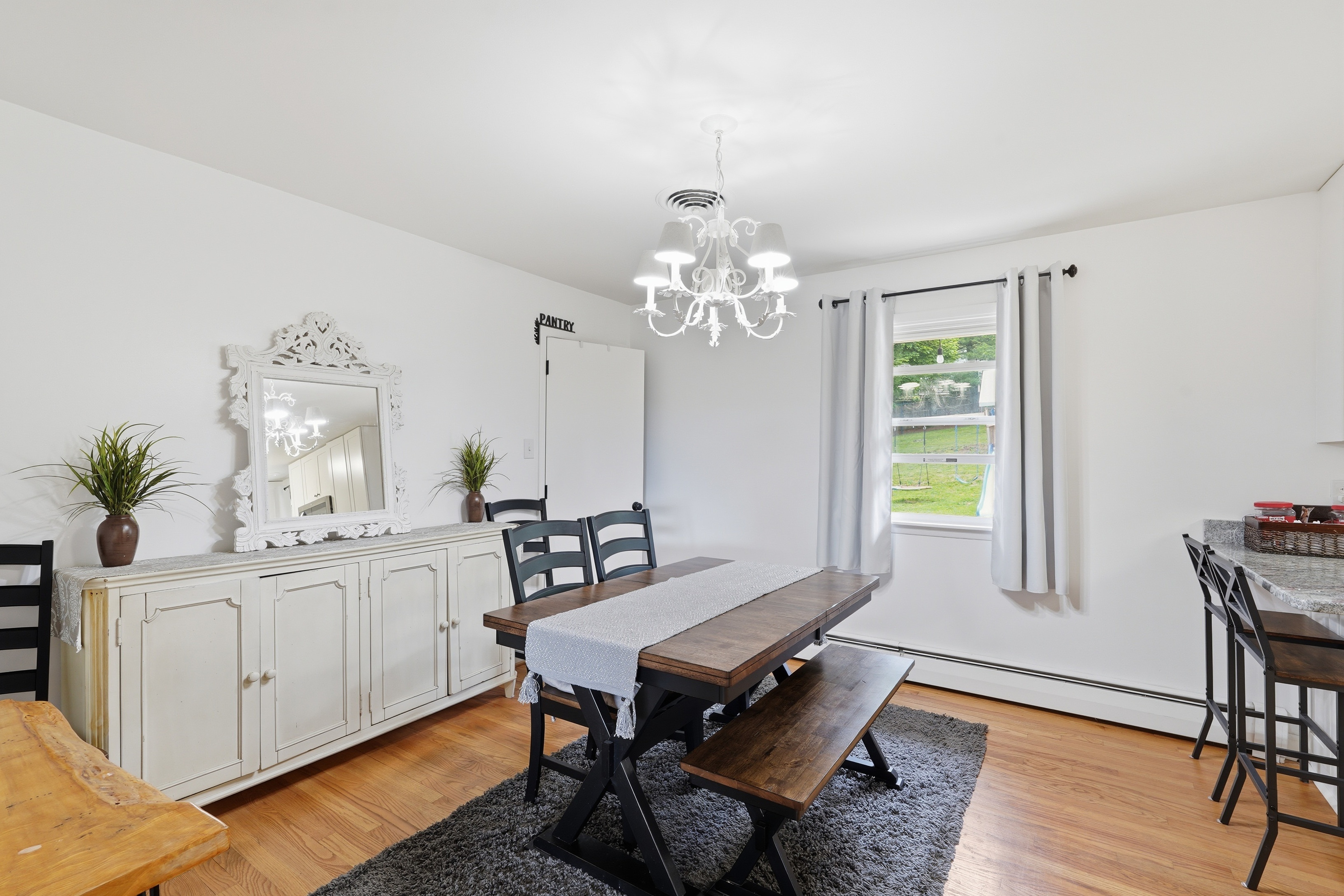 7717 McKaig Road Frederick, MD 21701 - Photo 17 of 53 a living room with furniture and a chandelier