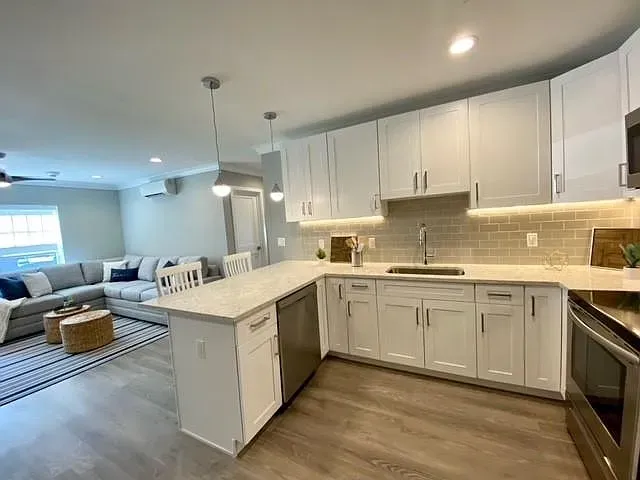 a kitchen that has a sink and a stove in it