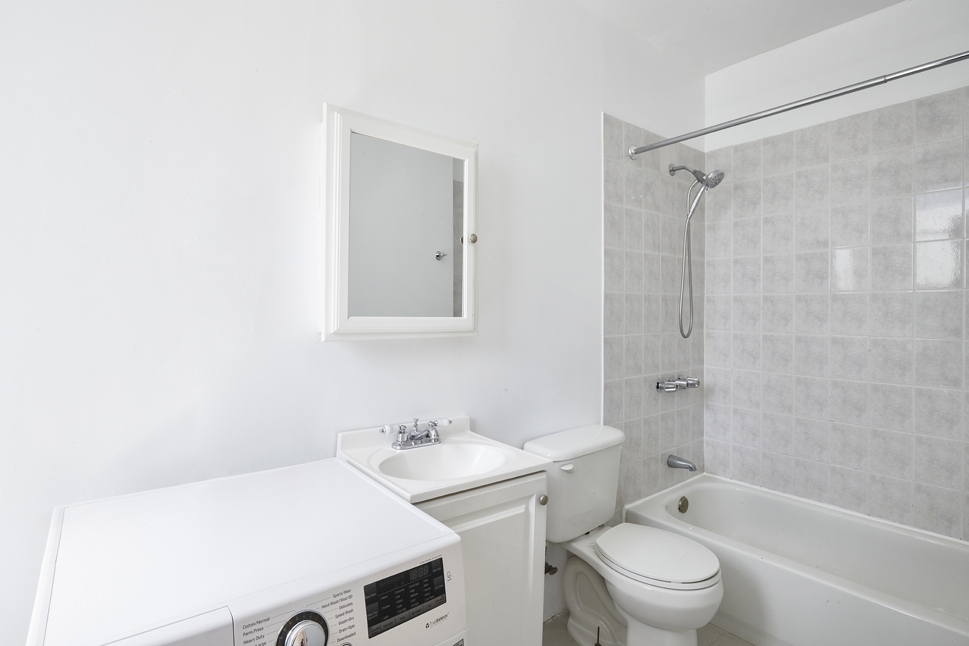276 Stuyvesant Avenue, Unit 2 Brooklyn, NY 11221 - Photo 10 of 11 a bathroom with a sink toilet vanity and shower