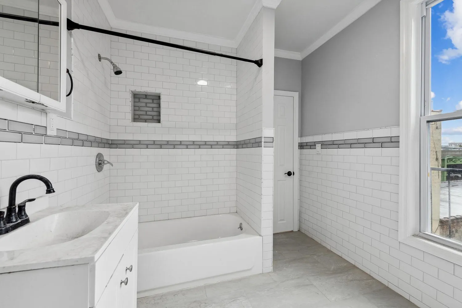 a bathroom with a sink a mirror and a bathtub