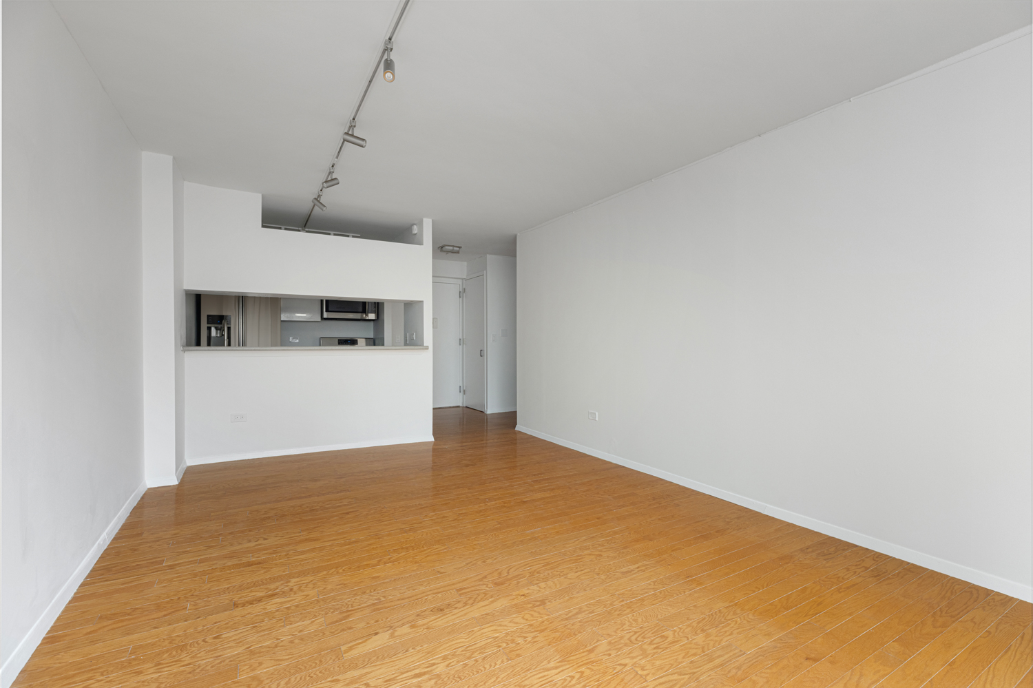 2 South End Avenue, Unit 8E Manhattan, NY 10280 - Photo 4 of 16 a view of a kitchen with wooden floor