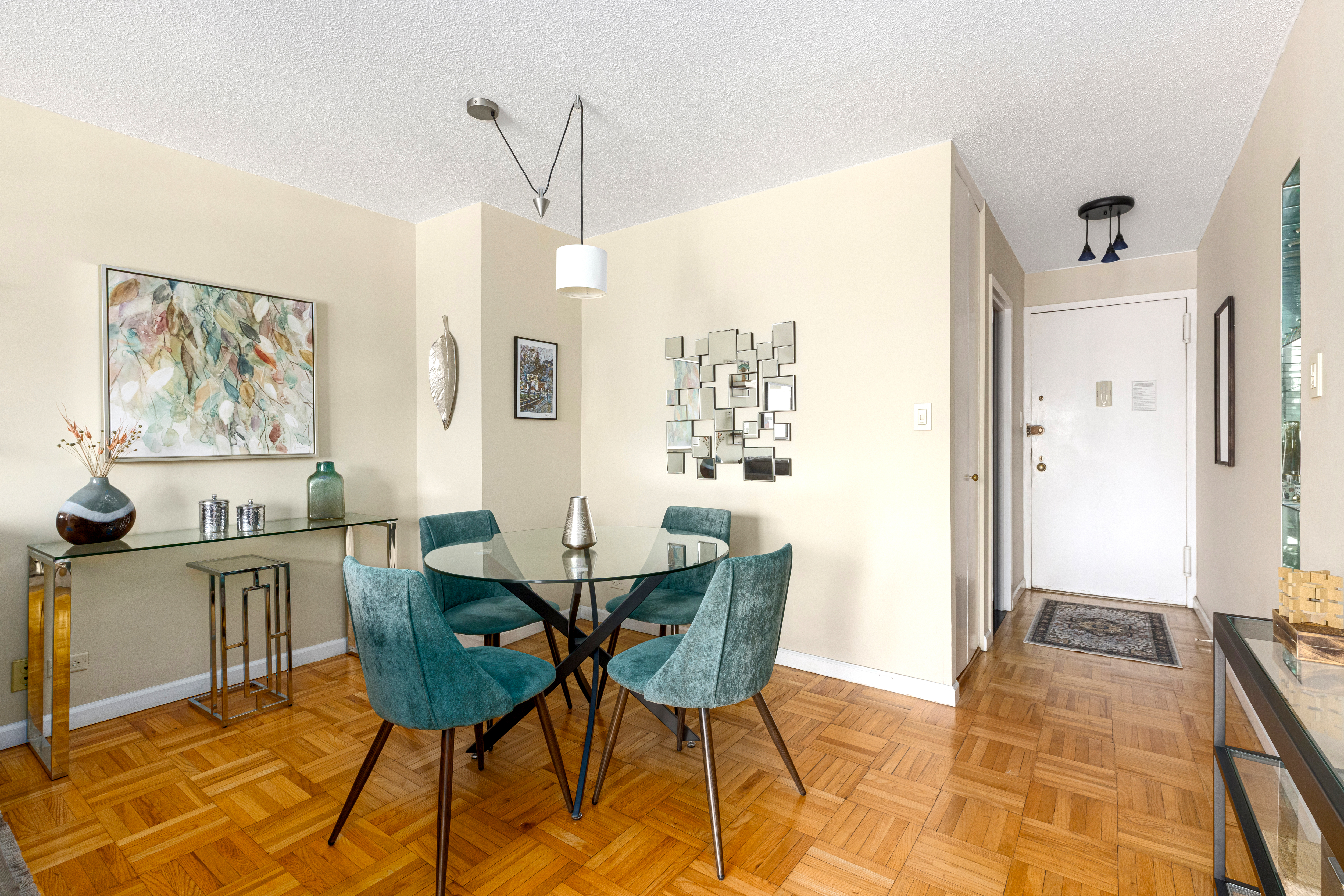 201 West 70th Street, Unit 17A Manhattan, NY 10023 - Photo 3 of 20 a view of a dining room with furniture and a rug