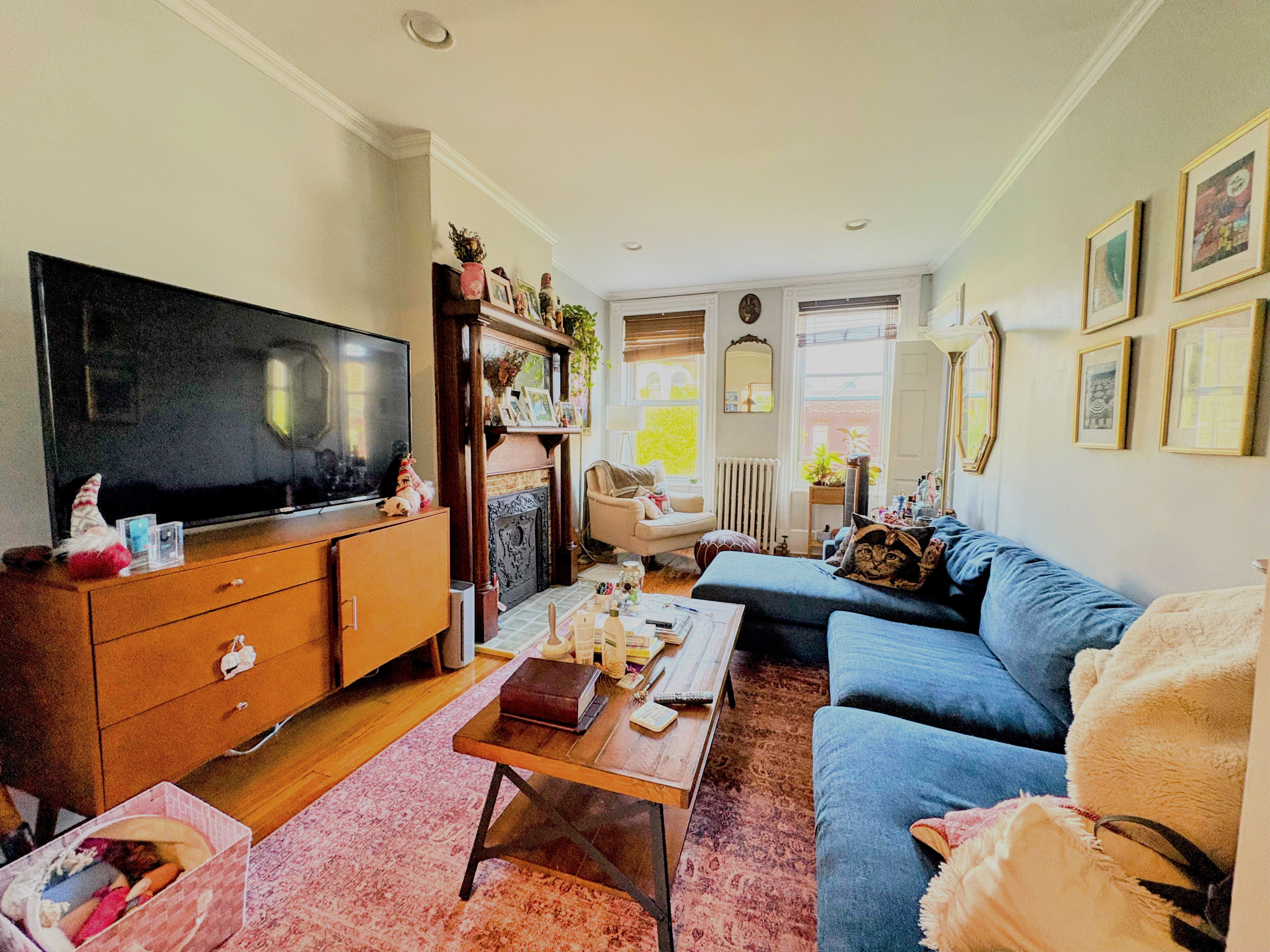 304 7th Avenue, Unit 3 Brooklyn, NY 11215 - Photo 4 of 15 a living room with furniture and a flat screen tv