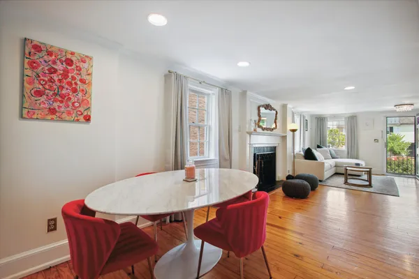 a view of a dining room with furniture window and wooden floor