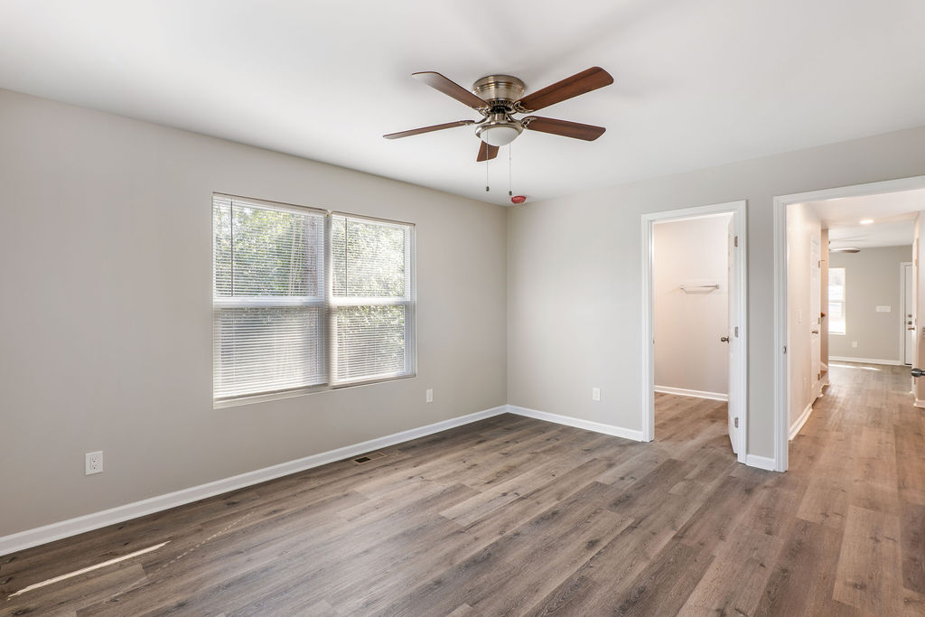 320 Adams Avenue Batesburg, SC 29006 - Photo 19 of 28 wooden floor in an empty room with a window