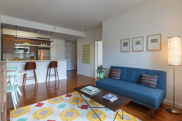 22 Caton Place, Unit 6DD Brooklyn, NY 11218 - Photo 2 of 16 a living room with furniture and wooden floor