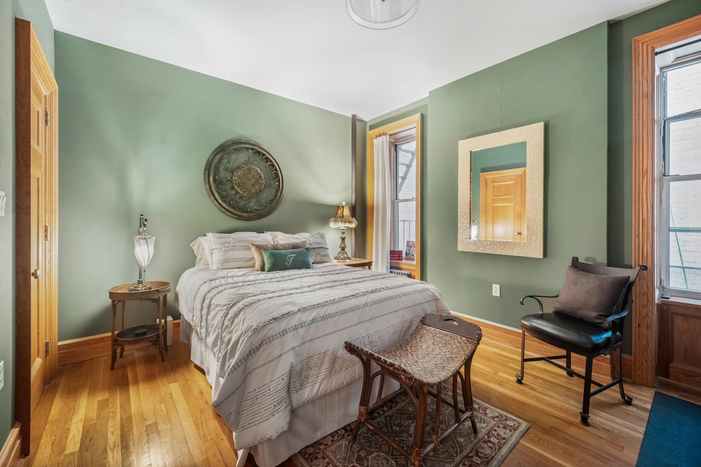300 West 109th Street, Unit 2JK Manhattan, NY 10025 - Photo 14 of 18 a bedroom with a bed and wooden floor