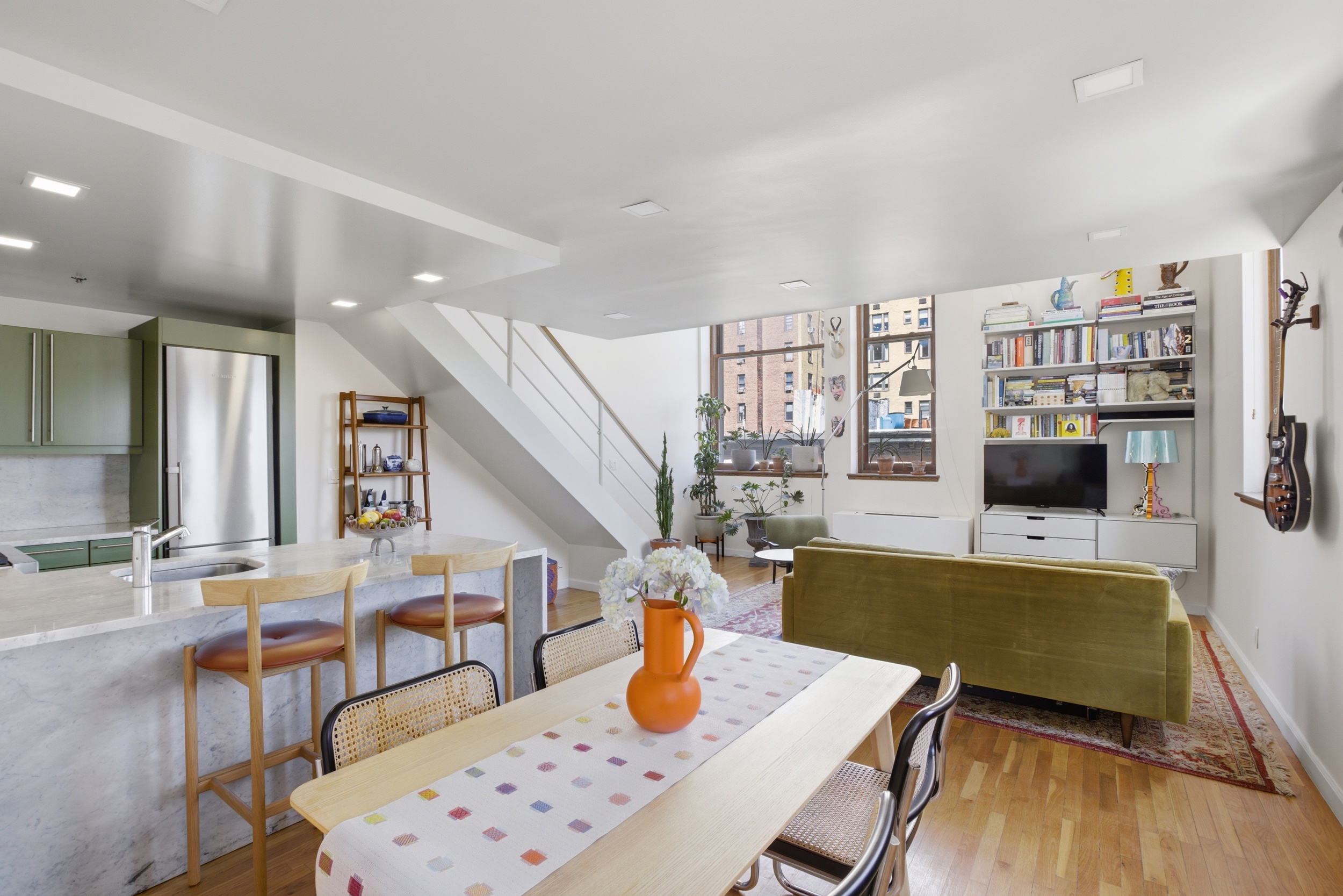305 2nd Avenue, Unit 521 Manhattan, NY 10003 - Photo 3 of 20 a living room with furniture and a wooden floor