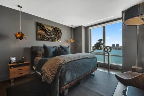 a bedroom with bed and window
