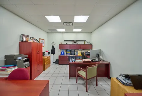 a view of a workspace with furniture