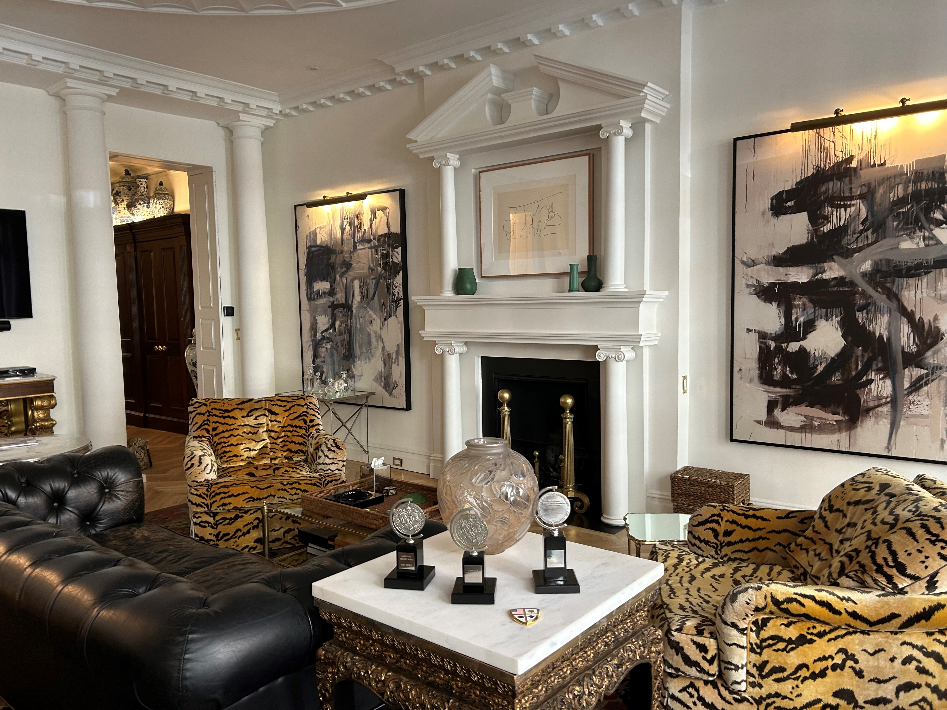 36 East 69th Street, Unit 2AB Manhattan, NY 10021 - Photo 7 of 26 a living room with furniture and a fireplace