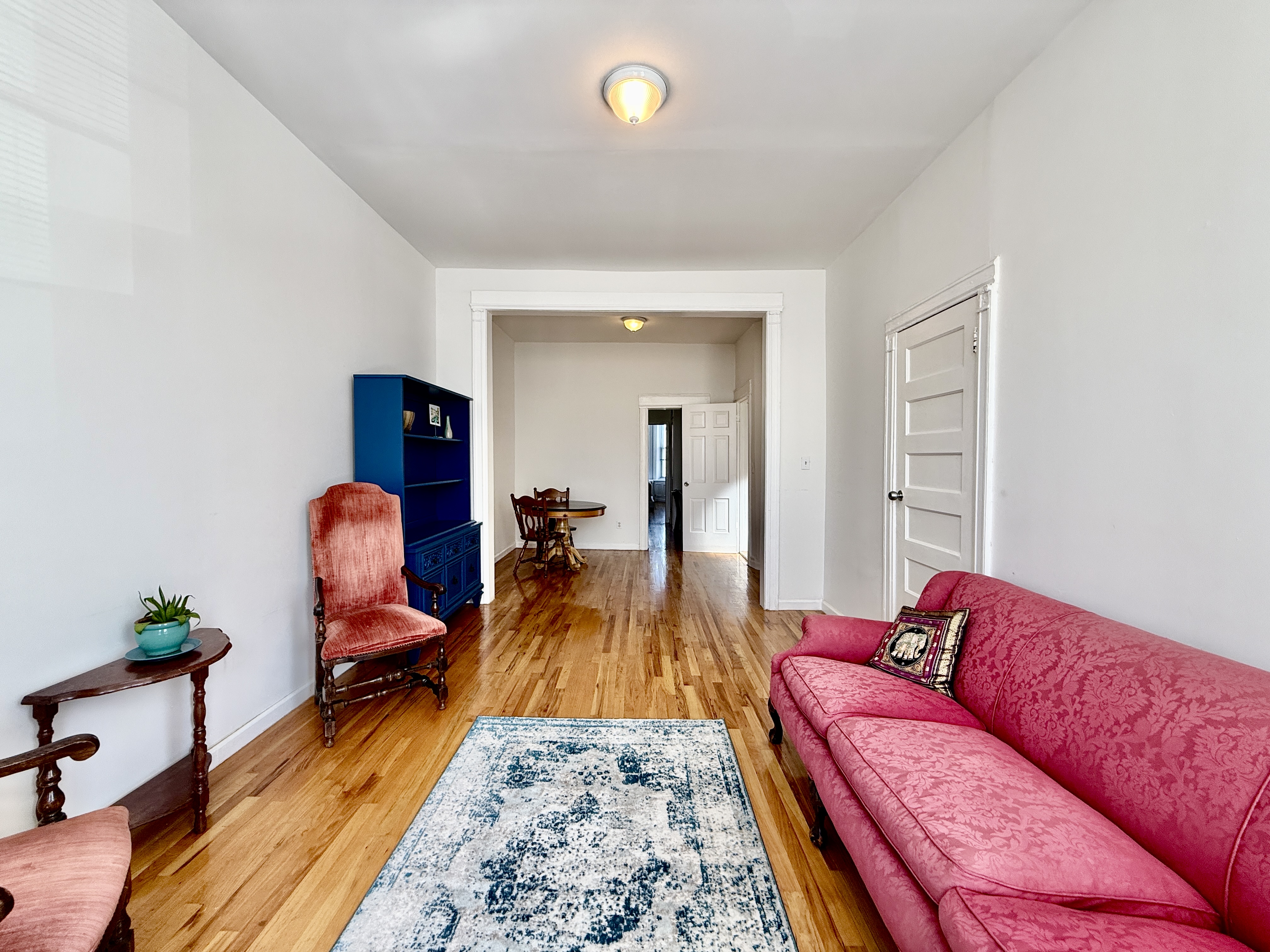 149 East 35th Street, Unit 2 Brooklyn, NY 11203 - Photo 3 of 10 a living room with furniture and a wooden floor