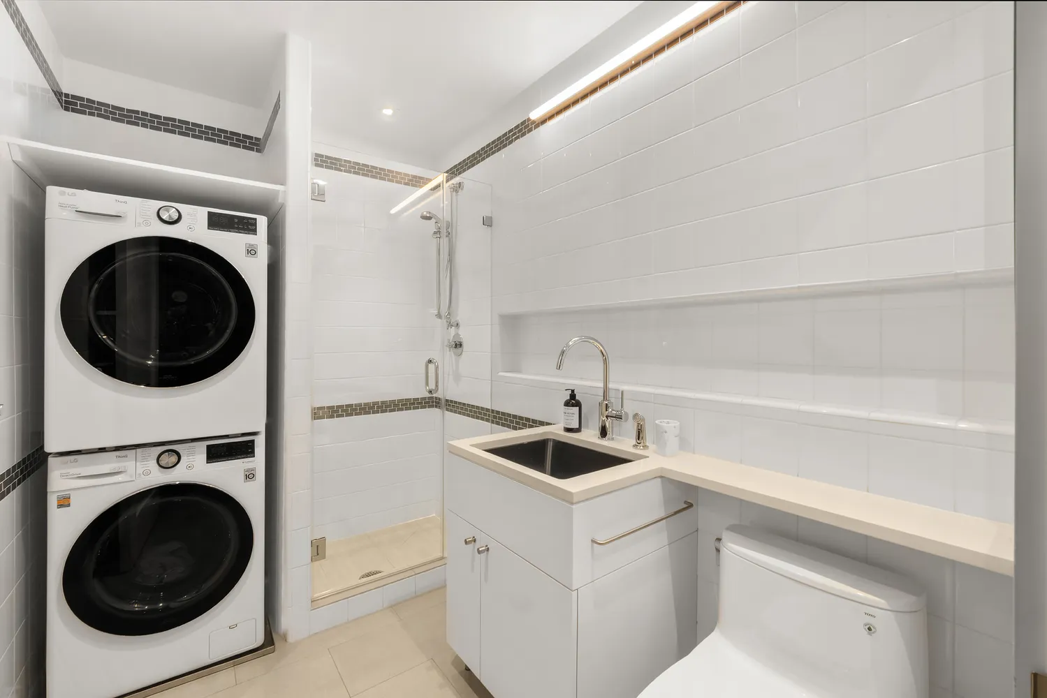 a bathroom with a sink double vanity and a bathtub