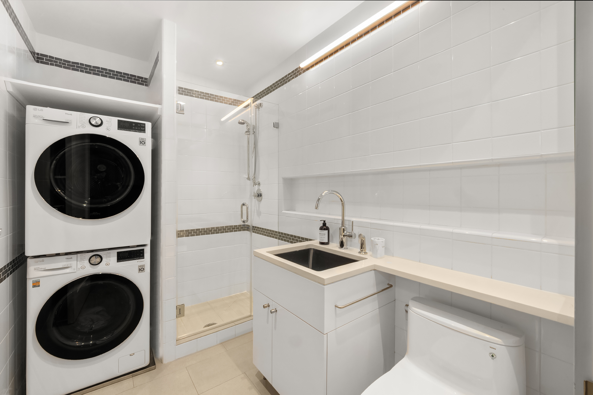 110 Central Park South, Unit 12ABC Manhattan, NY 10019 - Photo 38 of 49 a utility room with sink dryer and washer
