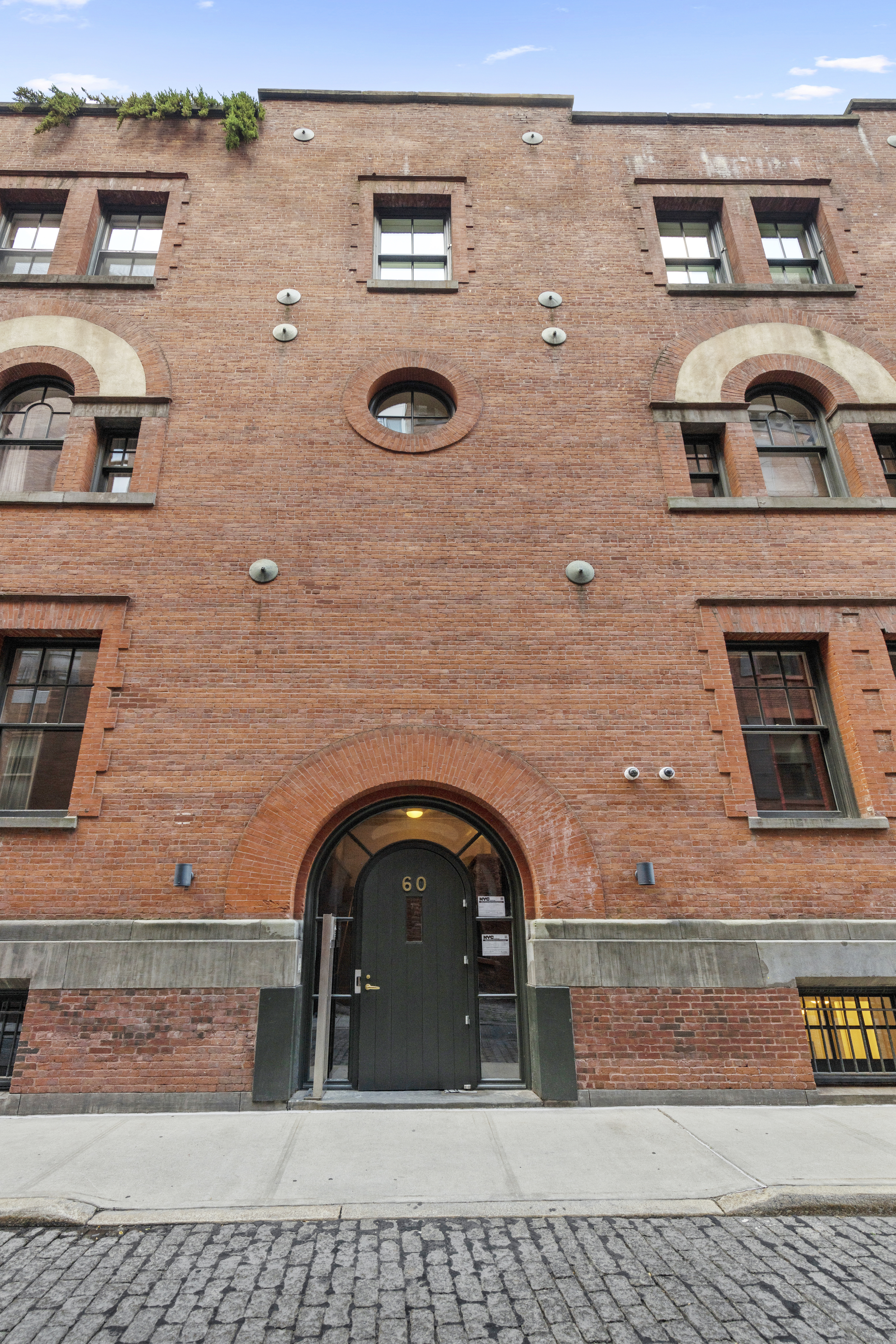 60 Collister Street, Unit 1B Manhattan, NY 10013 - Photo 18 of 20 a front view of a building with parking space