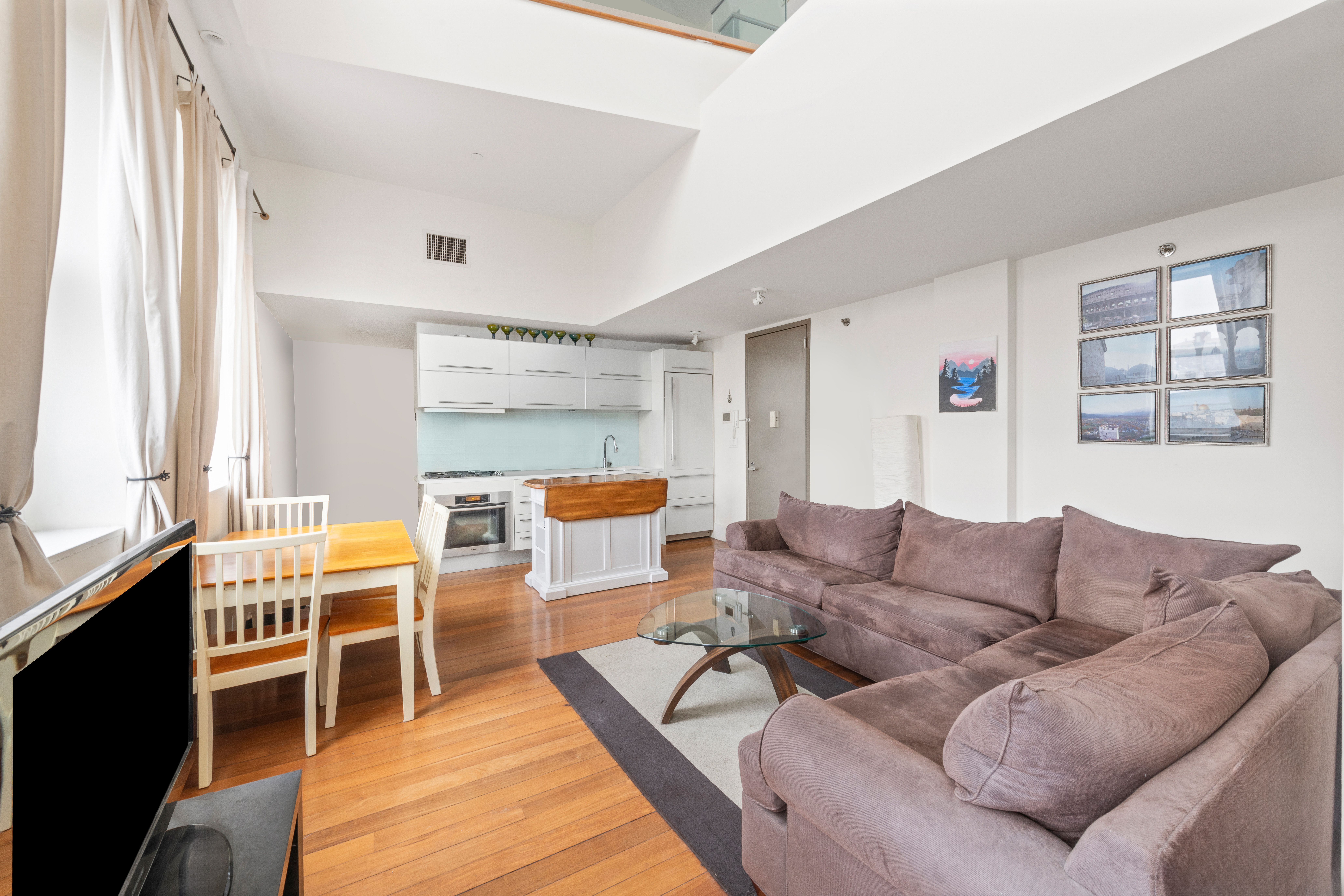 50 Bayard Street, Unit 3J Brooklyn, NY 11211 - Photo 2 of 13 a living room with furniture wooden floor and a window