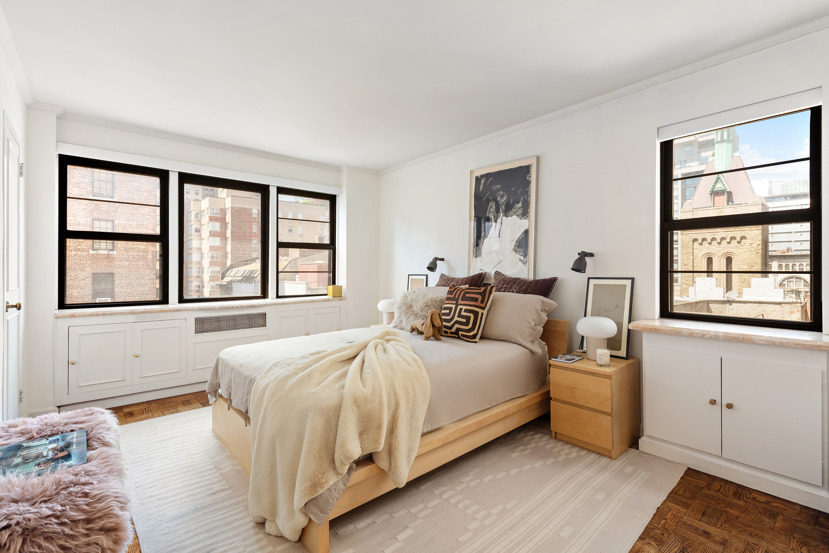 39 Gramercy Park North, Unit 9A Manhattan, NY 10010 - Photo 4 of 12 a bedroom with a bed and a large window