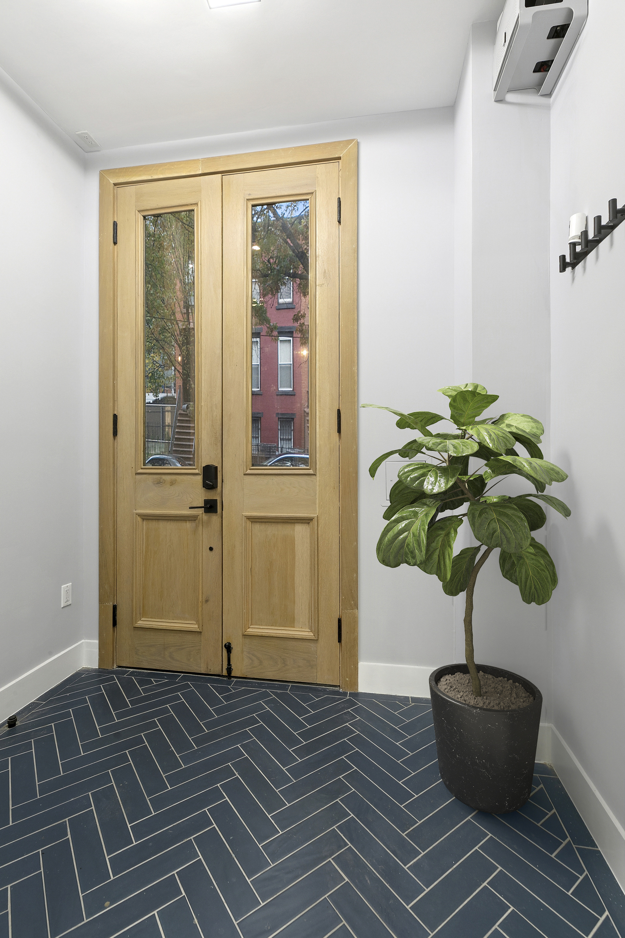 434 Throop Avenue, Unit 2 Brooklyn, NY 11221 - Photo 18 of 20 a living room with a potted plant