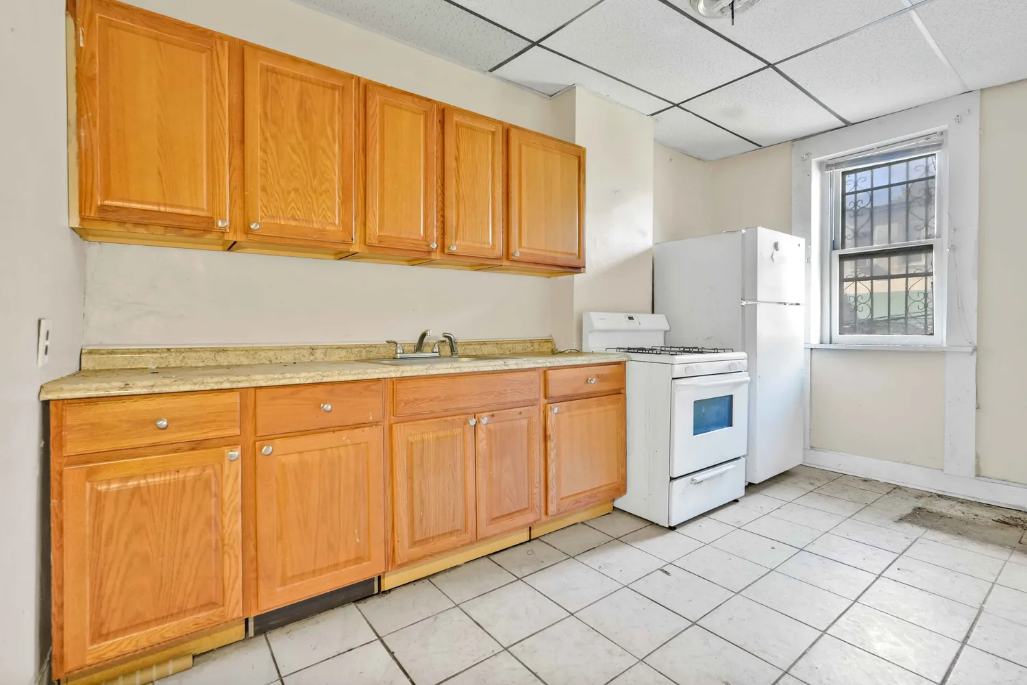 a view of a kitchen with stainless steel appliances granite countertop cabinets and a stove top oven
