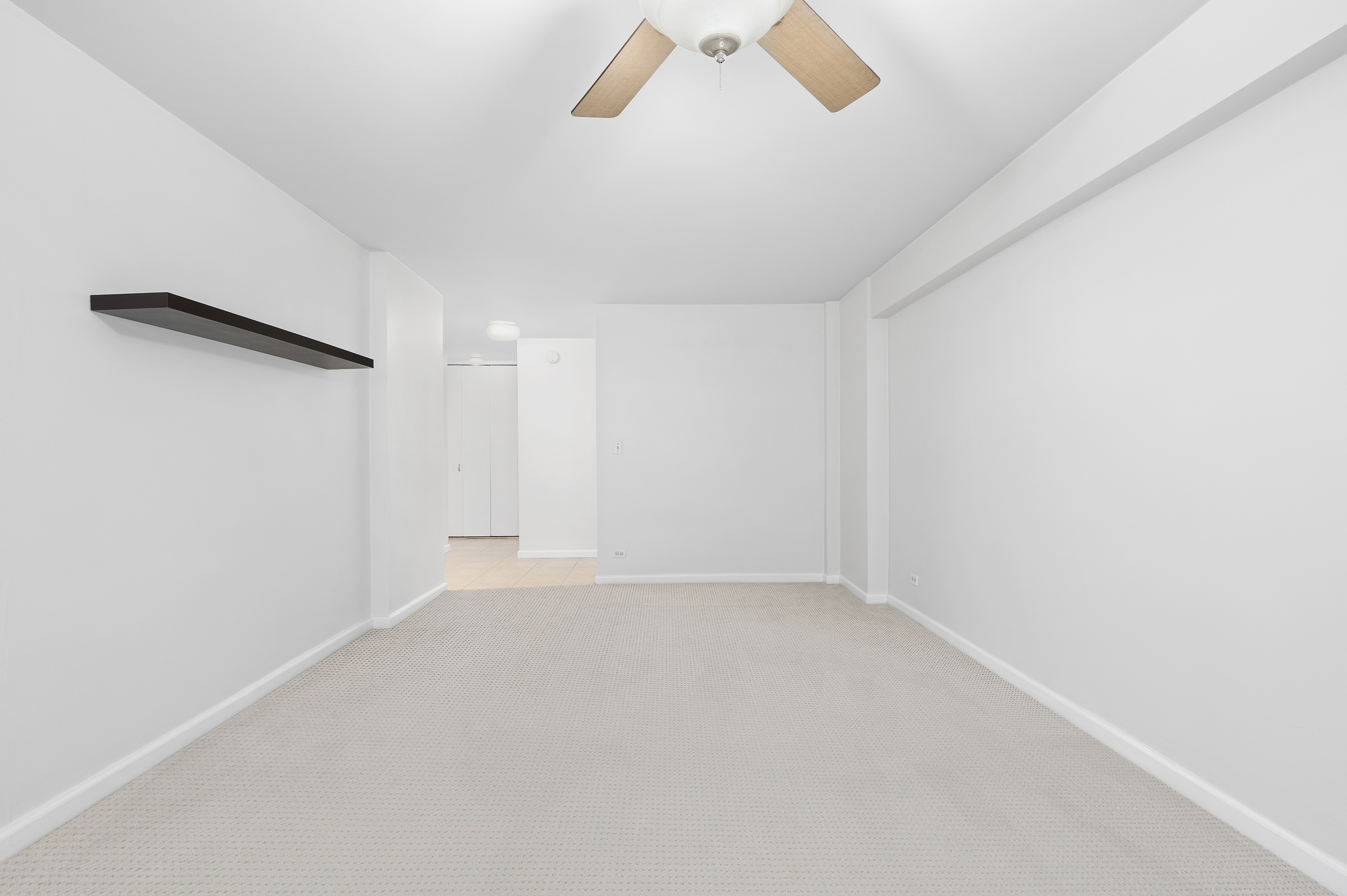 153 East 57th Street, Unit 8J Manhattan, NY 10022 - Photo 6 of 8 a view of an empty room