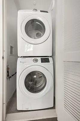 17 Convent Avenue, Unit 3D Manhattan, NY 10027 - Photo 8 of 9 a utility room with dryer and washer