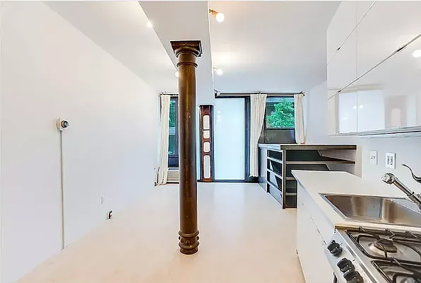 20 Renwick Street, Unit AB Manhattan, NY 10013 - Photo 3 of 9 a kitchen with stainless steel appliances granite countertop a sink a stove and a refrigerator